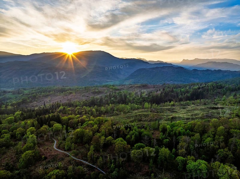 Sunset over Mountains and Coniston Water from drone, Lake District National Park, Cumbria, England, United Kingdom