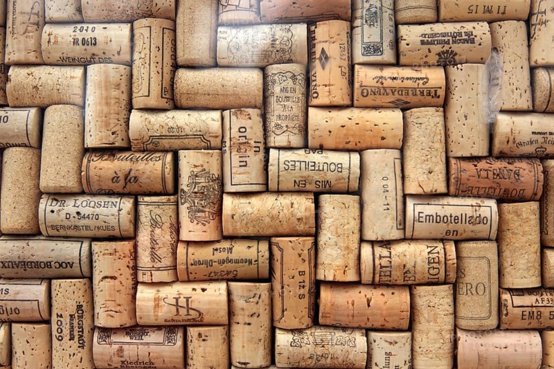 Corks from wine bottles laid as a regular pattern, wine corks, red wine
