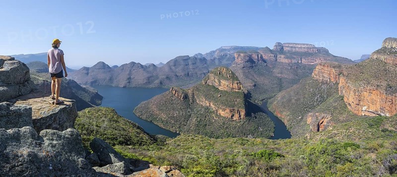 Hiker enjoying panorama, Blyde River Canyon with summit Three Rondawels, view of canyon with river Blyde River and table mountains, canyon landscape, Panorama Route, Mpumalanga, South Africa