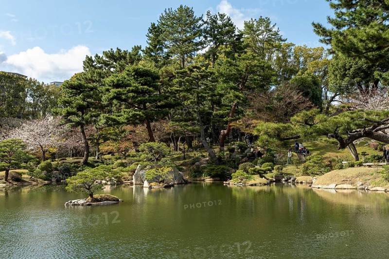 Shukkei-en with Sekisui-gan stone formation and Takuei-chi pond in spring, historical Japanese strolling garden, Japanese garden, green area, tourist attraction, sight, Naka-ku, Hiroshima, Japan