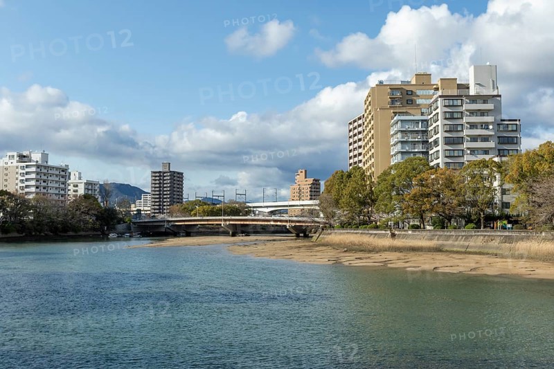 High-rise buildings and bridge over the Kyobashi-gawa River in spring, Naka-ku, Hiroshima, Japan