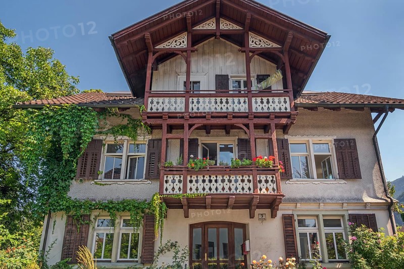 Old villa with wooden shingle façade, large balcony with floral decorations, around 1900, Dornbirn, Vorarlberg, Austria