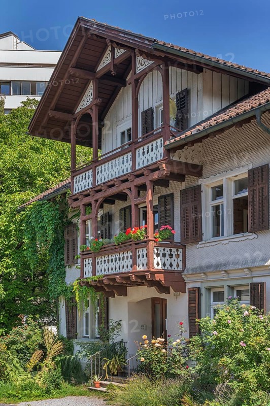 Old villa with wooden shingle façade, large balcony with floral decorations, around 1900, Dornbirn, Vorarlberg, Austria