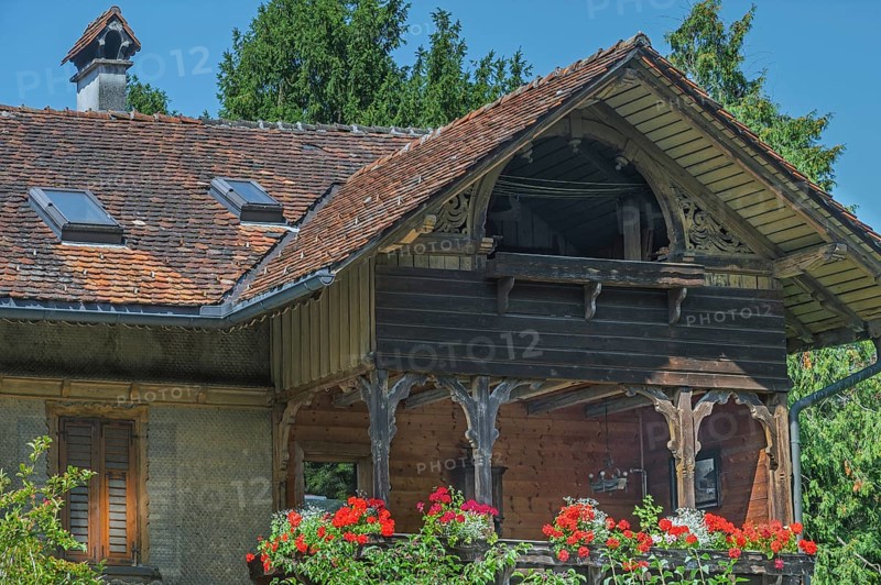 Old villa with wooden shingle façade, large balcony with floral decorations, around 1900, Dornbirn, Vorarlberg, Austria