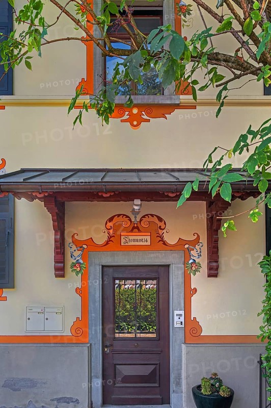 Yellow façade with wooden front door, Dornbirn, Vorarlberg, Austria