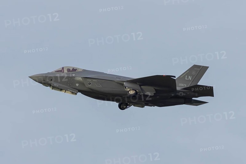 Lockheed Martin F-35 Lightning II fighter military aircraft of the United States air force USAF taking off in flight at RAF Lakenheath airbase, Suffolk, England, United Kingdom