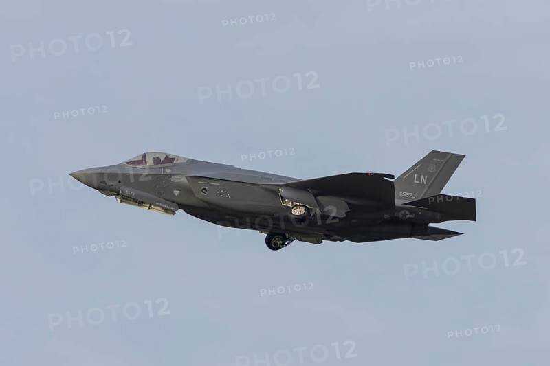 Lockheed Martin F-35 Lightning II fighter military aircraft of the United States air force USAF taking off in flight at RAF Lakenheath airbase, Suffolk, England, United Kingdom