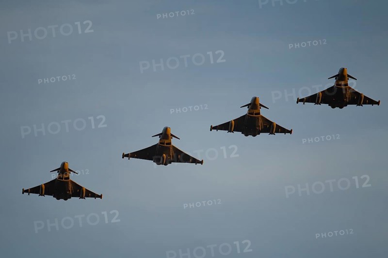 Eurofighter Typhoon four military fighter jet aircraft of the Royal air force RAF flying in formation, England, United Kingdom