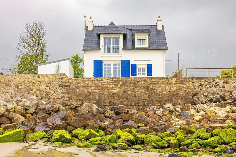 Cute residential house by the beach on a stone pier, Morgat, Crozon peninsula, Bretagne, France