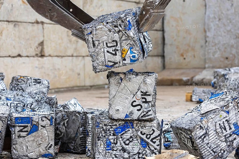 Cubes made from scrap metal, disused car licence plates. Symbolic photo. Stuttgart, Baden-Württemberg, Germany