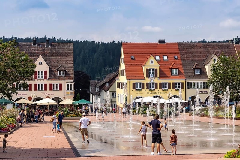 Fountains on the market square in Freudenstadt in the Black Forest, the largest built-up market square in Germany. The 219 by 216 metre square is the town's landmark. Freudenstadt, Baden-Württemberg, Germany