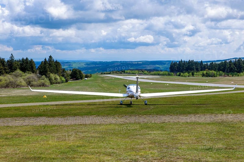 Motorised glider taxiing to the runway at Wasserkuppe airfield, Rhön, Gersfeld, Fulda district, Hesse, Germany