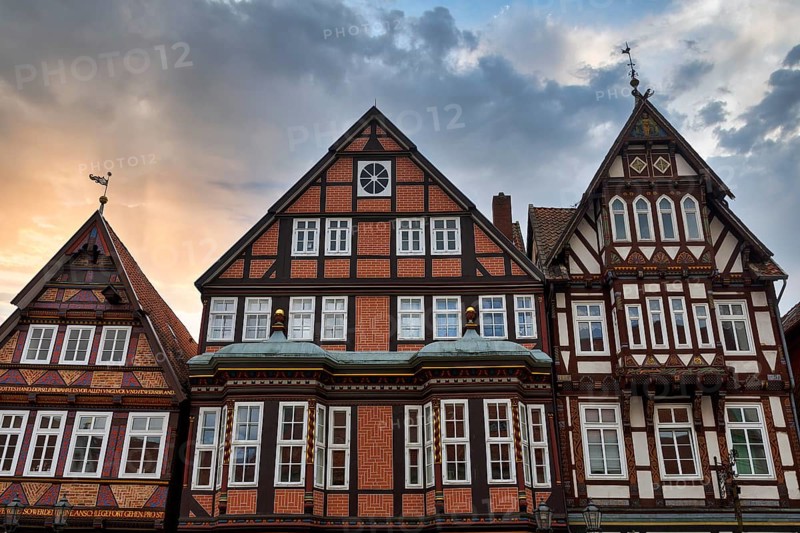 Characteristic half-timbered houses in the historic old town, Brick Gothic, splendidly decorated wooden beams, pier railway, evening sky, Celle, Lüneburg Heath, Germany