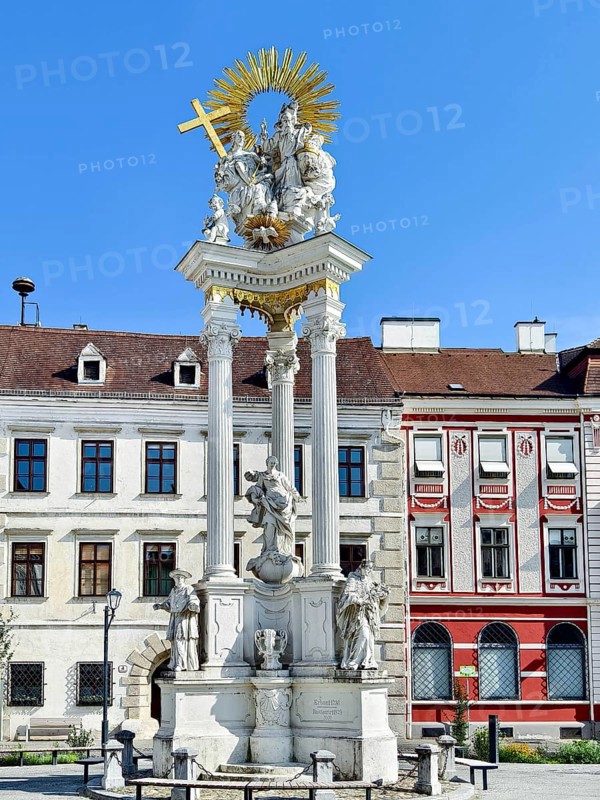 Baroque monument with ornate columns and figures on a Trinity Column Old Town Krems Wachau Waldviertel Lower Austria Austria