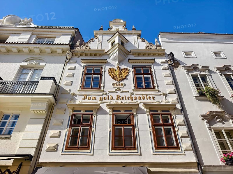 Decorative historic façade with eagle on a bright blue sky Old town Bürgerhaus Zum goldenen Reichsadler Krems Wachau Waldviertel Lower Austria Austria