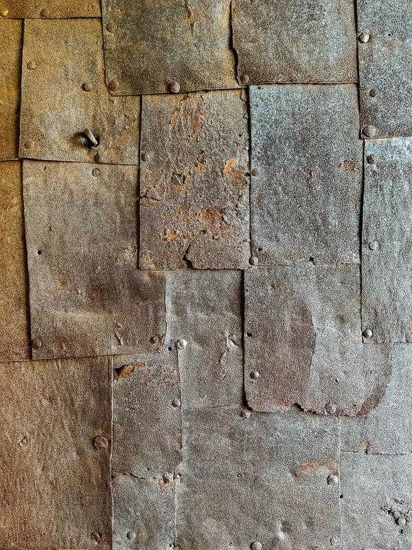 Textured rusty metal panels with rivets forming an industrial surface Riegersburgs Styria Austria