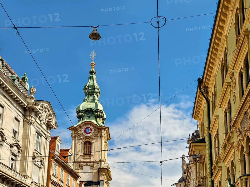 Historic architecture on a busy street with visible power lines Herz Jesu Kirche Graz Styria Austria