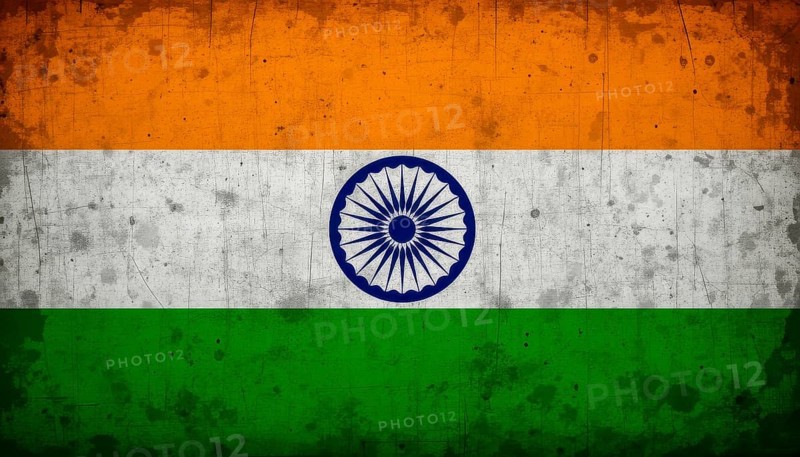 A weathered, vintage-style image of the Indian flag, featuring saffron, white, green stripes and the Ashoka Chakra, AI generated