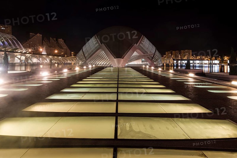 Illuminated modern architecture at night in Valencia with symmetrical design