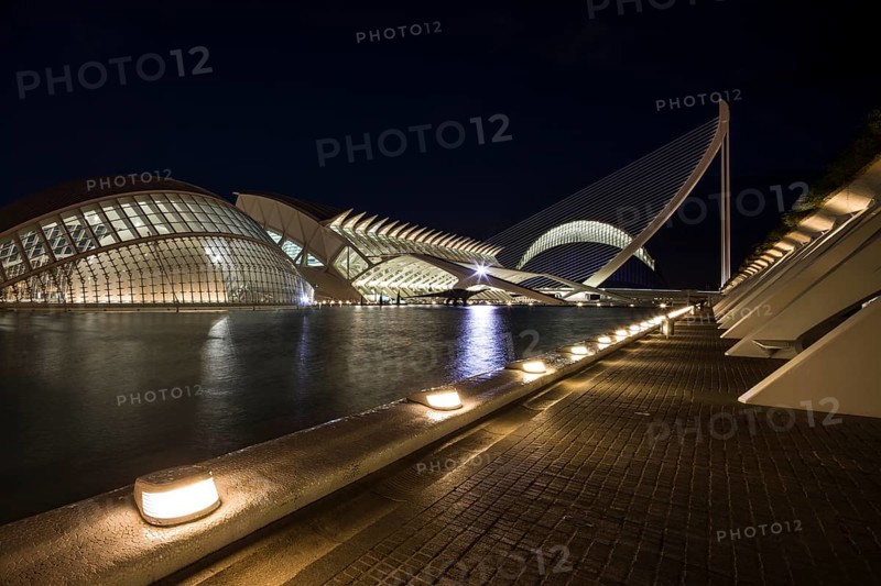 Valencia Spain Evening city view with illuminated modern bridge and buildings