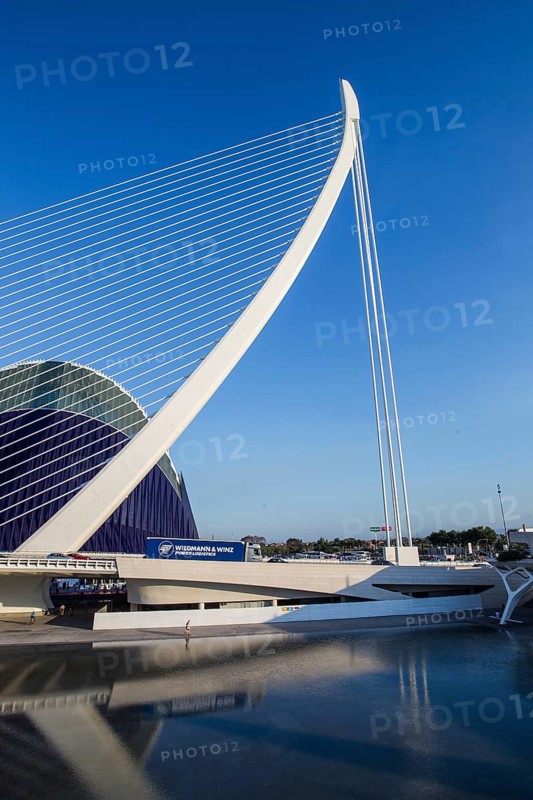 Futuristic bridge with an elegant design against a clear blue sky in Valencia