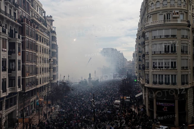 Protesting crowds move through a smoky city centre MascletÃ¡ de Fallas