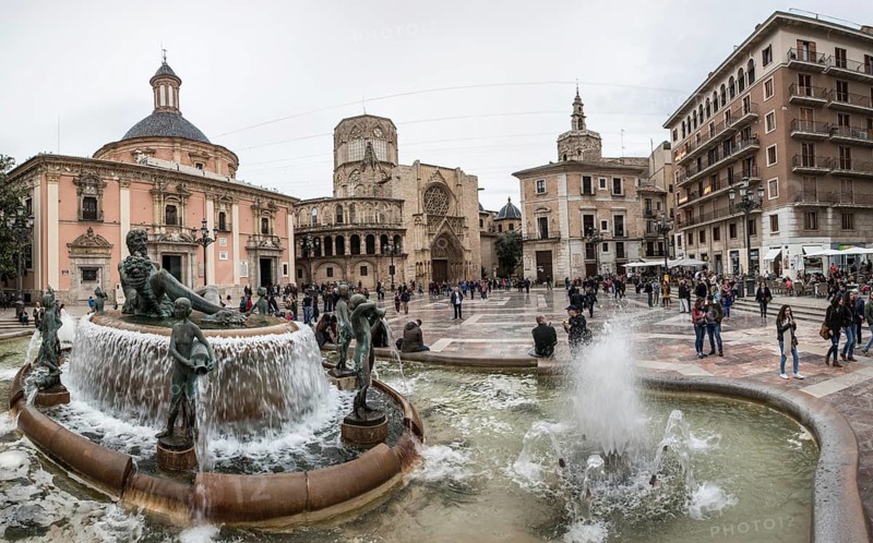 Historic fountain in front of the Virgen de los Desamparados Naval Museum Fuente del Turia fountain in PlaÃ§a De La Mare de DÃ©u
