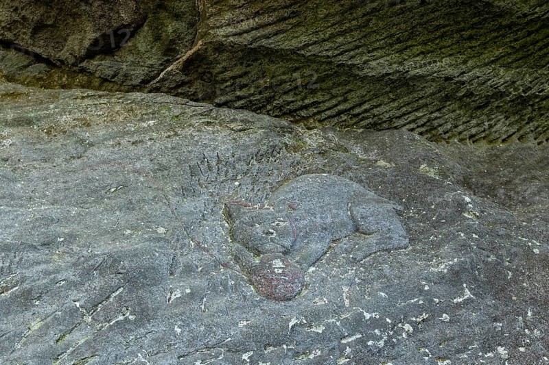 Close-up of a cat figure with a ball of wool carved into the stone on the Shariki-michi Trail to Mount Nokogiri, Mount Nokogiri, Hamakanaya, Futtsu, Chiba Prefecture, Japan