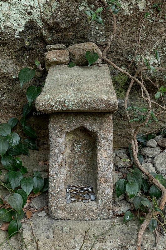Small stone house for offerings with yen coins on the Shariki-michi Trail to Mount Nokogiri, Mount Nokogiri, Hamakanaya, Futtsu, Chiba Prefecture, Japan