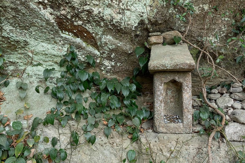 Small stone house for offerings with yen coins on the Shariki-michi Trail to Mount Nokogiri, Mount Nokogiri, Hamakanaya, Futtsu, Chiba Prefecture, Japan