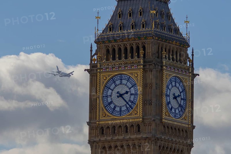 Big Ben or The Elizabeth Tower clock tower of the Palace of Westminster or Houses of Parliment with an Airbus A380 jet aircraft flying in the background, City of London, England, United Kingdom