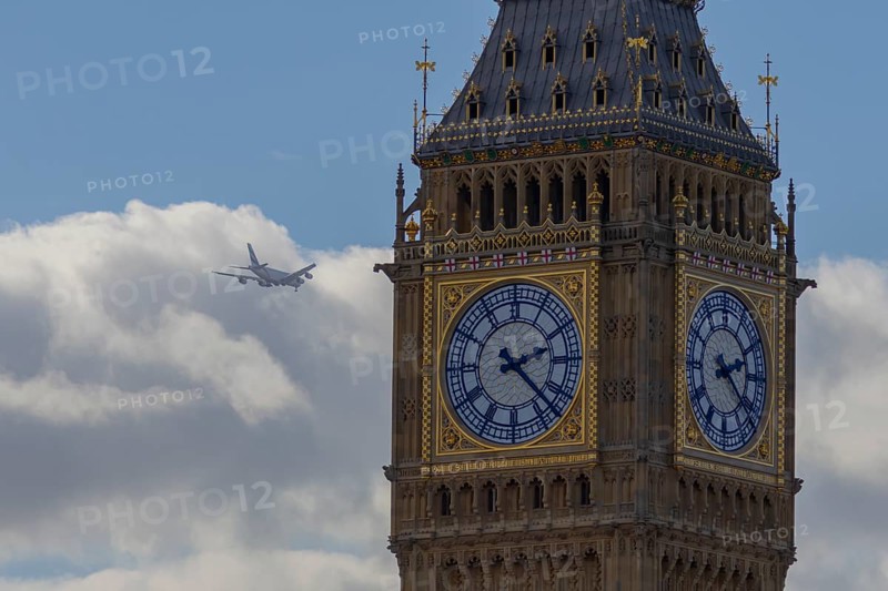 Big Ben or The Elizabeth Tower clock tower of the Palace of Westminster or Houses of Parliment with an Airbus A380 jet aircraft flying in the background, City of London, England, United Kingdom