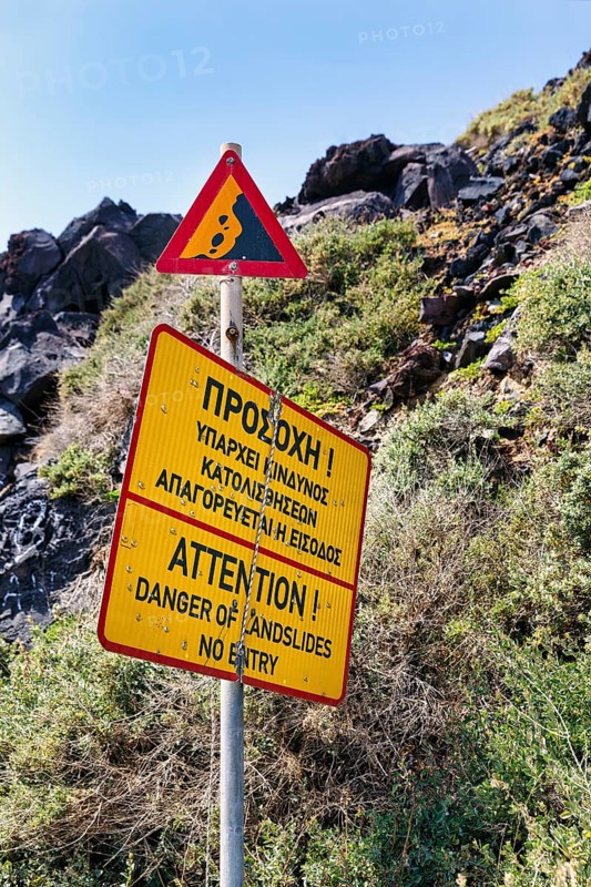 Signs warning of landslide and falling rocks, no entry, cliffs, Red Beach, Kokkini Paralia, Akrotiri, Santorini, Cyclades, Greece
