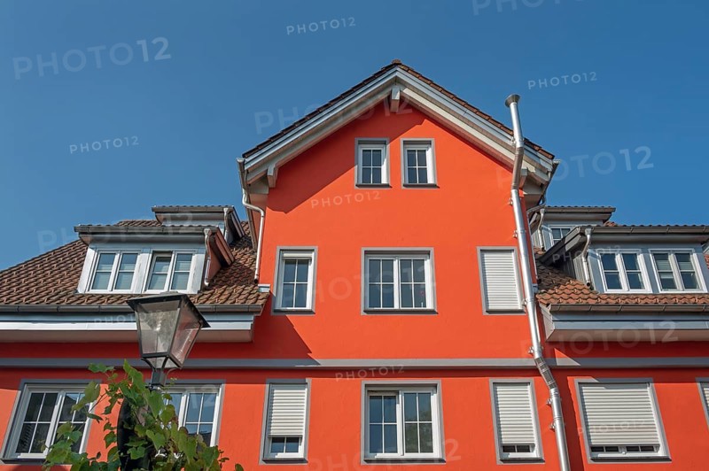Red pointed gable facade with dormers, blue sky, Isny, Swabia, Baden-WÃ¼rttemberg, Germany