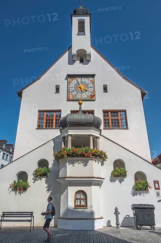 West faÃ§ade with clock, floral decorations and strollers, town hall, Kempten, AllgÃ¤u, Bavaria, Germany
