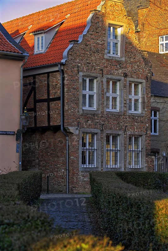 Charming half-timbered house with red tiled roof in the sunlight, DÃ¼sseldorf-Kaiserswerth