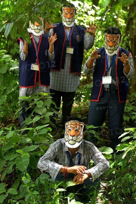 Agartala, Tripura, India, 29-07-2025: Students of NSS (National Service Scheme) unit from Mahatma Gandhi Memorial School wearing tiger masks during an event on Tiger Conservation on International Tiger day, organised by Sima Chakma, coordinator of MGM NSS UNIT at Agartala. International Tiger day is an annual celebration to raise awareness for tiger conservation, held annually on 29th July. Photo By-Abhisek Saha
