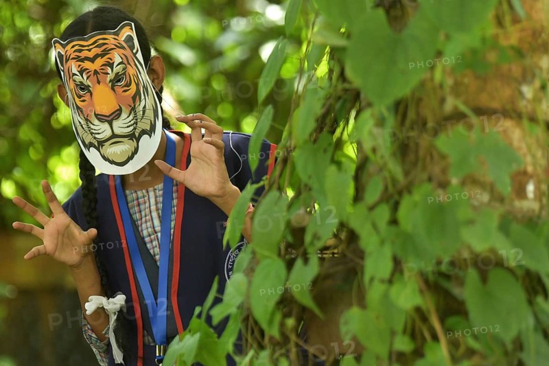 Agartala, Tripura, India, 29-07-2025: Students of NSS (National Service Scheme) unit from Mahatma Gandhi Memorial School wearing tiger masks during an event on Tiger Conservation on International Tiger day, organised by Sima Chakma, coordinator of MGM NSS UNIT at Agartala. International Tiger day is an annual celebration to raise awareness for tiger conservation, held annually on 29th July. Photo By-Abhisek Saha