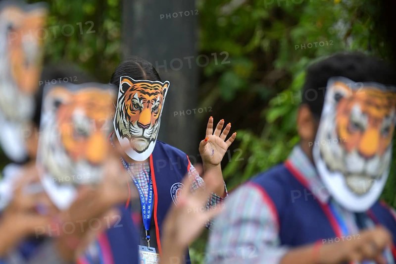 Agartala, Tripura, India, 29-07-2025: Students of NSS (National Service Scheme) unit from Mahatma Gandhi Memorial School wearing tiger masks during an event on Tiger Conservation on International Tiger day, organised by Sima Chakma, coordinator of MGM NSS UNIT at Agartala. International Tiger day is an annual celebration to raise awareness for tiger conservation, held annually on 29th July. Photo By-Abhisek Saha