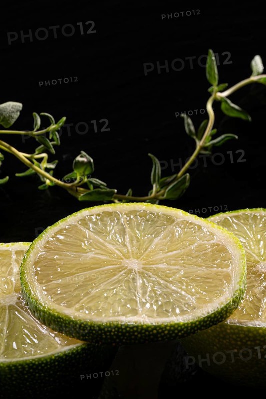 Three lime slices with green decoration