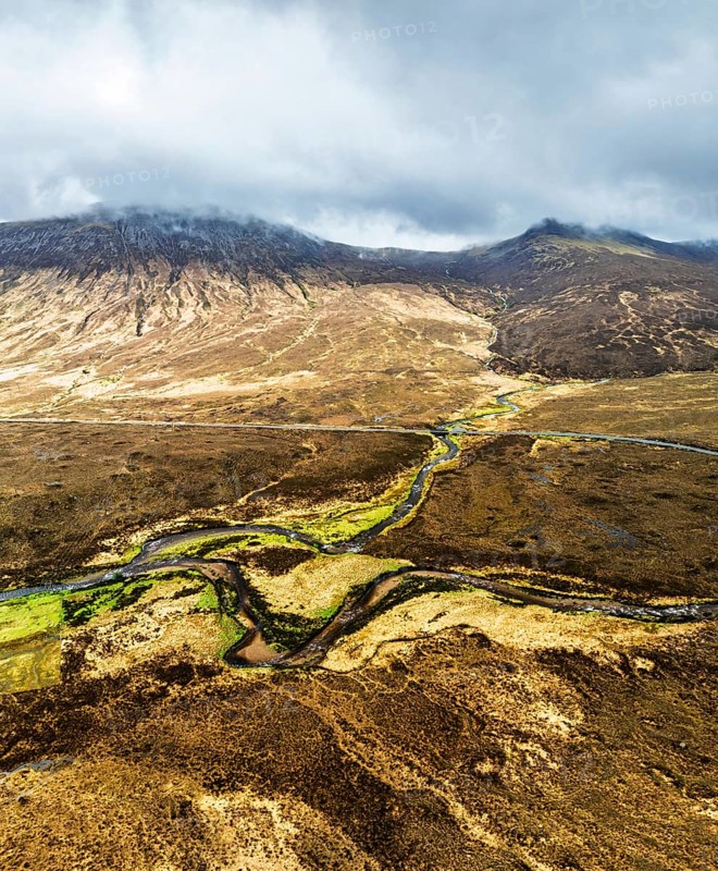 Panorama of Eas a' Bhradain Waterfall from drone, Red Cuillin mountains, Loch Ainort, Isle of Skye, Scotland, UK