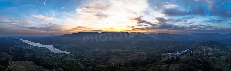 Panorama of Sunset over Mountains and Coniston Water from drone, Lake District National Park, Cumbria, England, United Kingdom