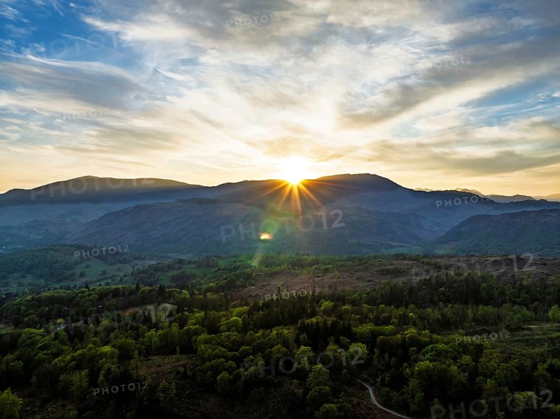 Sunset over Mountains and Coniston Water from drone, Lake District National Park, Cumbria, England, United Kingdom