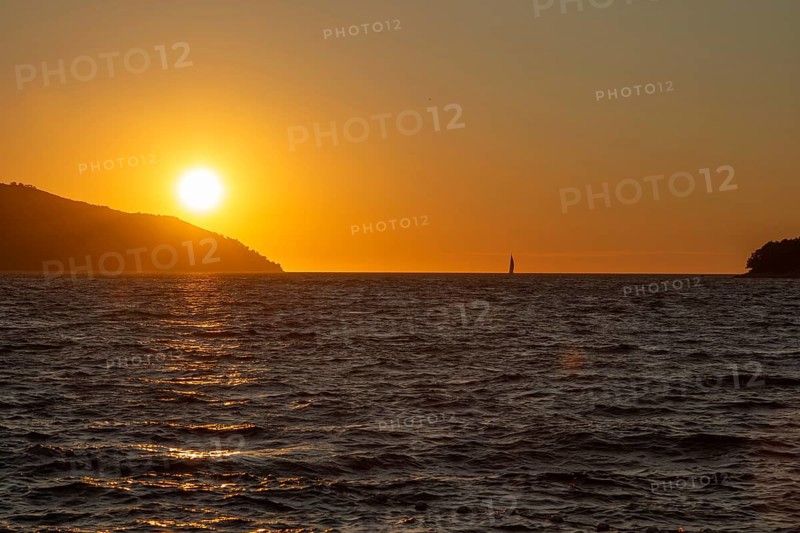 Sunset over the sea, sailing ship, near Starigrad, Dalmatia, Croatia