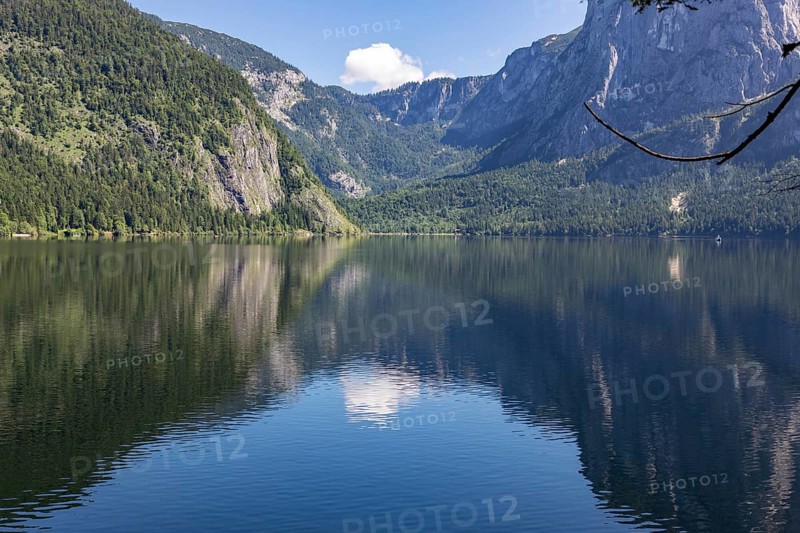 Lake Altaussee with mountains and wooded shores reflected in the water, Altaussee, Styria, Austria