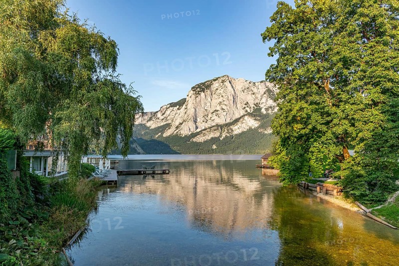 Lake Altaussee with Trisselwand and lush greenery at dusk, Altaussee, Styria, Austria