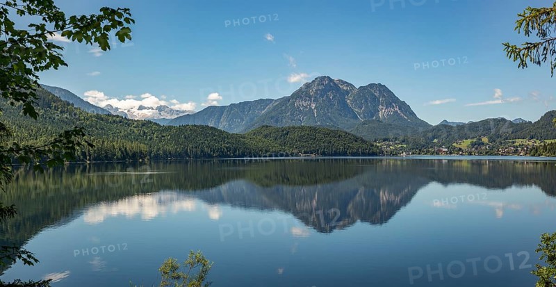 Peaceful lake surface with mountain panorama, Dachstein and Sarstein, cloud reflection in the water, Altaussee, Styria, Austria