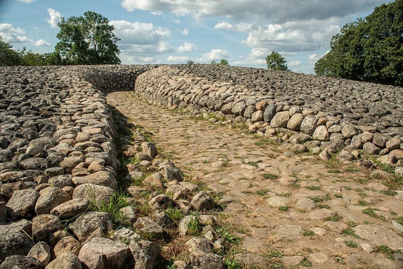 Entrance to King's grave, a 75-meter-diameter Bronze Age cairn containing a coffin with ten stone slabs with carved figures, in Kivik, Simrishamn Municipality, SkÃ¥ne County, Sweden, Scandinavia