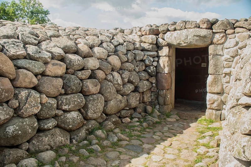 Entrance to King's grave, a 75-meter-diameter Bronze Age cairn containing a coffin with ten stone slabs with carved figures, in Kivik, Simrishamn Municipality, SkÃ¥ne County, Sweden, Scandinavia