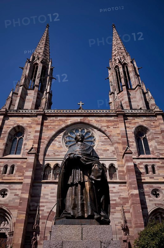 Monument, statue of Charles Emile Freppel, theologian and Bishop of Angers, in front of the church Ã‰glise Saints Pierre et Paul, St. Peter et St. Paul, old town, Obernai, also Oberehnheim, Bas-Rhin, Grand-Est, Alsace, France
